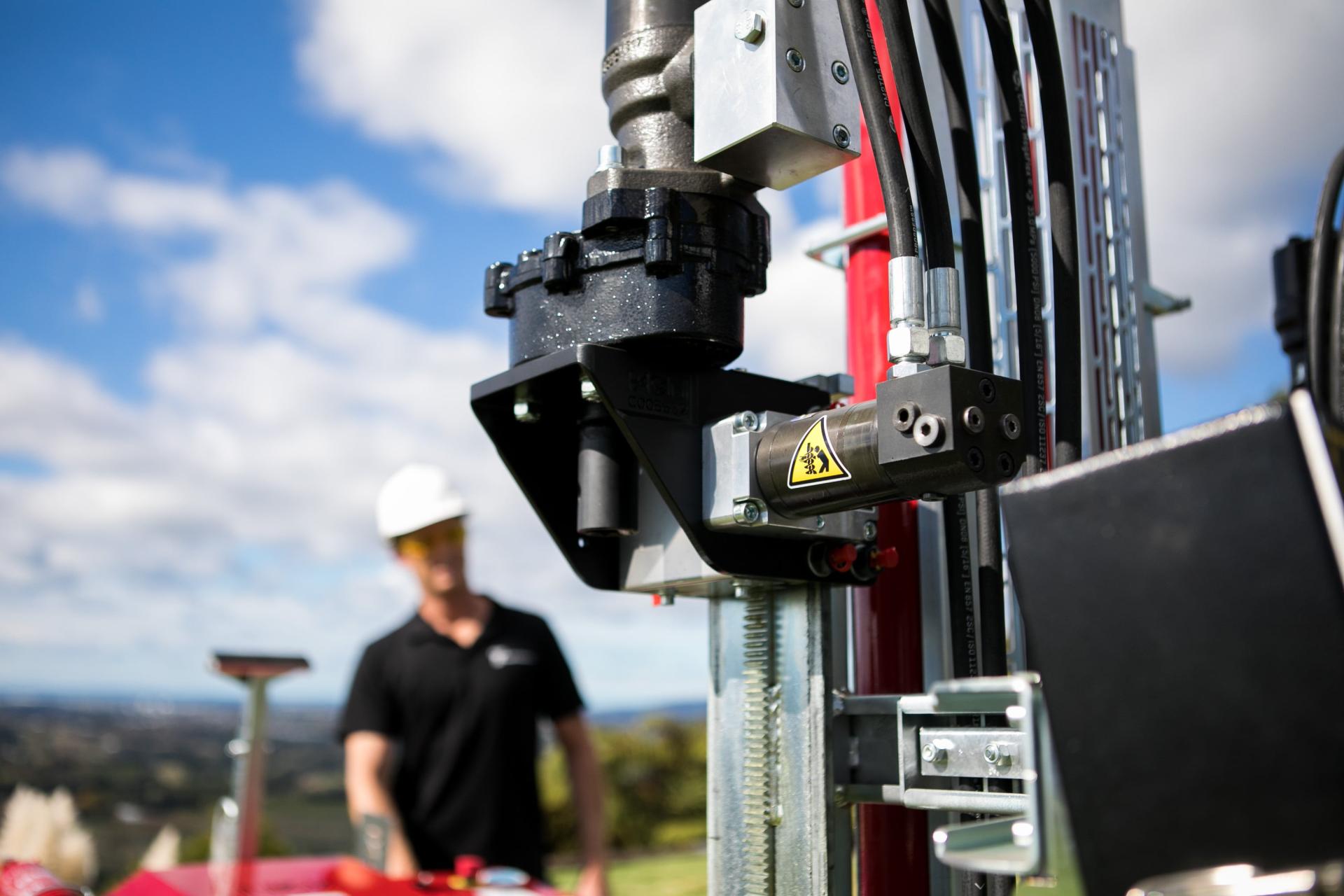 Close up shot of CPT machine with worker in the background